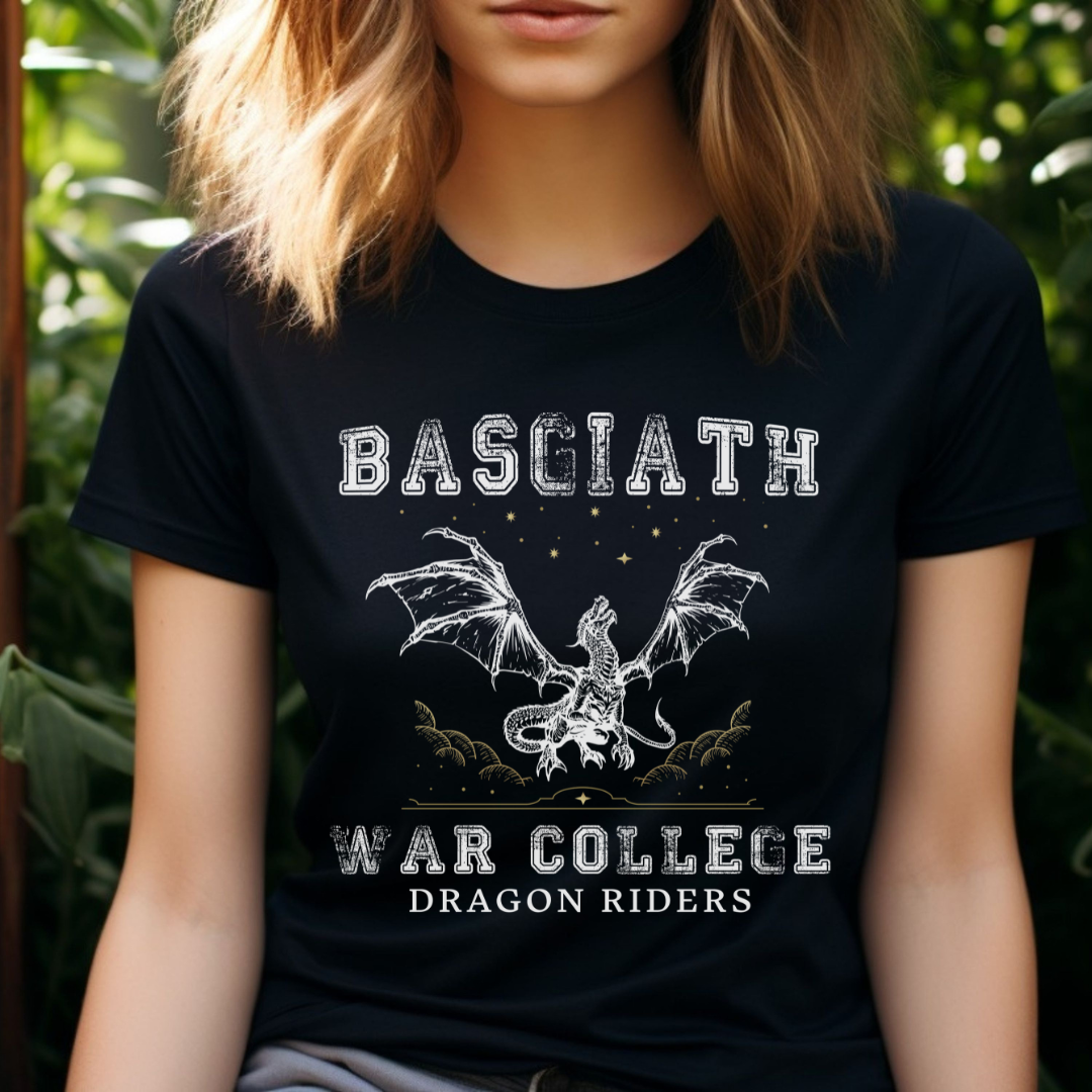 Young woman wih long hair wearing a black dragon rider Basgiath War College shirt for fantasy book readers of Fourth Wing, Iron Flame, and Onyx Storm created by graphic apparel company Midnight Gypsy Designs as part of their bookish merch collection.
