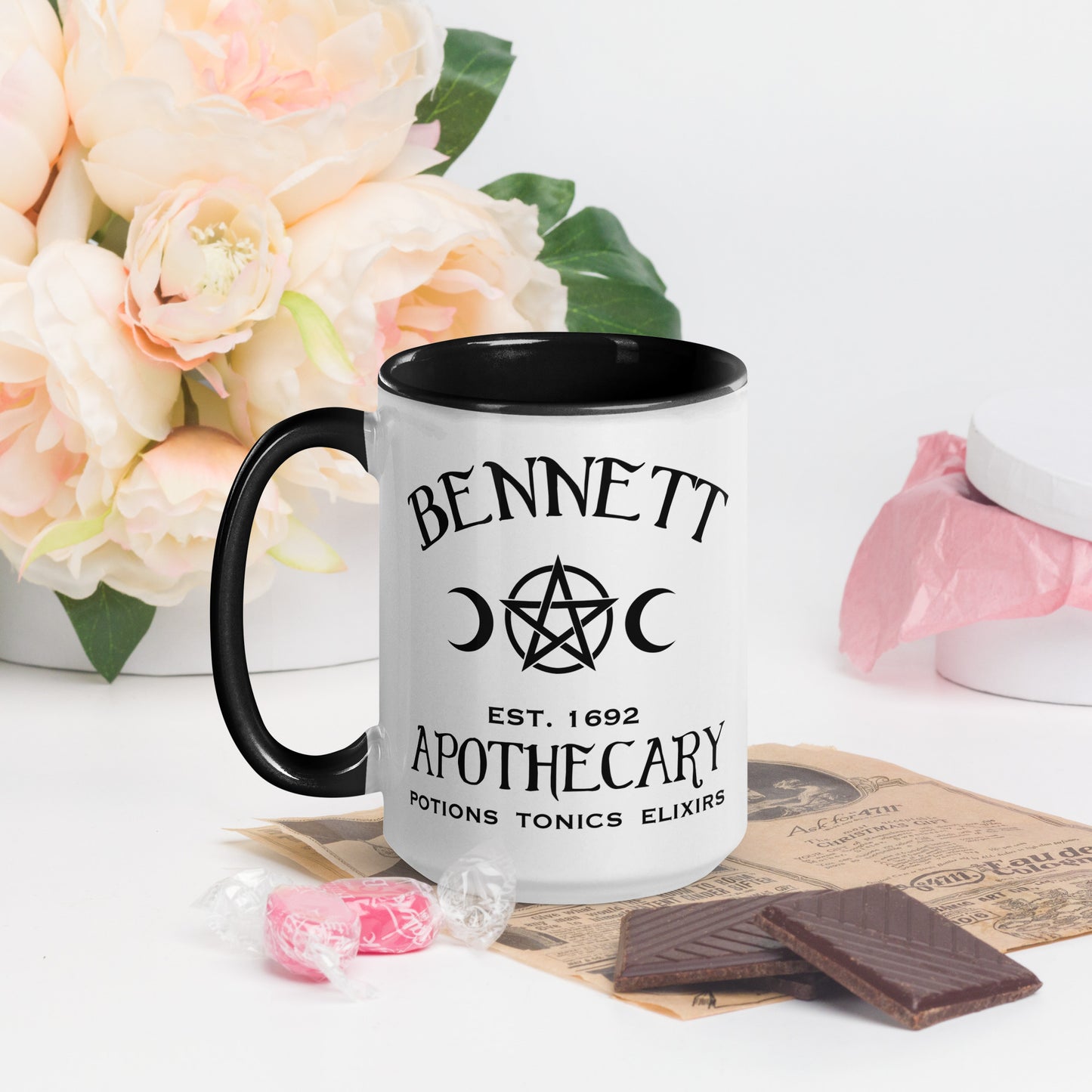 Black and white ceramic coffee mug with words Bennett Apothecary Established 1692 Potions Tonics Elixirs with moon and witch pentacle inspired by Bonnie Bennett from The Vampire Diaries created by the Midnight Gypsy Designs shop.