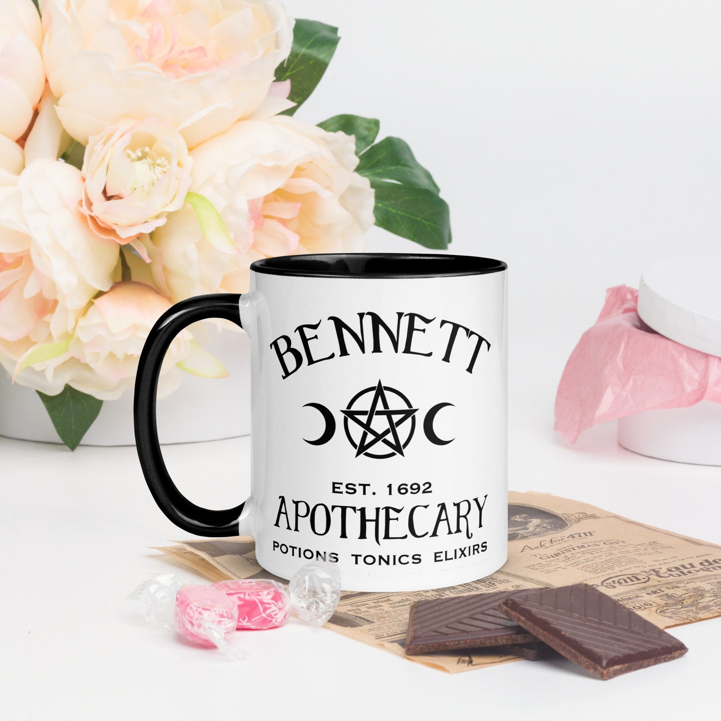 Black and white ceramic coffee mug with words Bennett Apothecary Established 1692 Potions Tonics Elixirs with moon and witch pentacle inspired by Bonnie Bennett from The Vampire Diaries created by the Midnight Gypsy Designs shop.