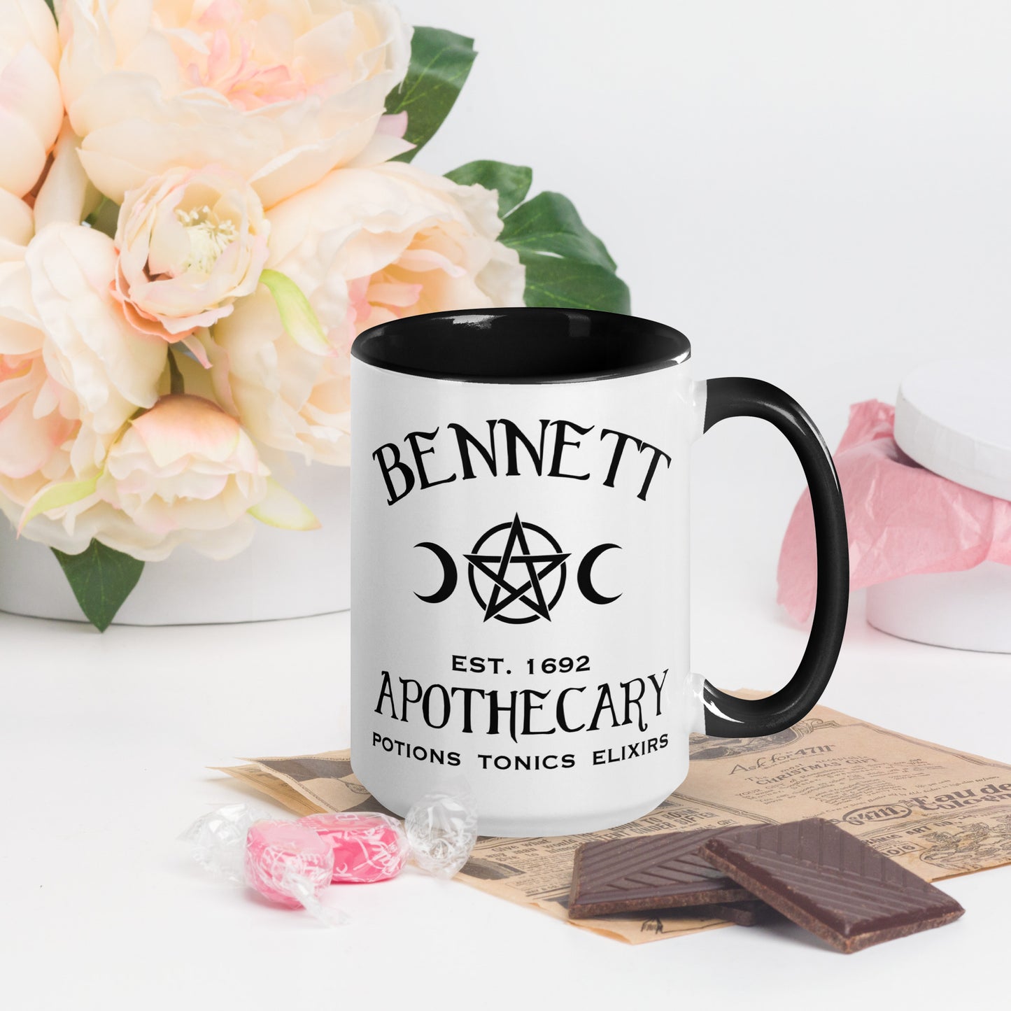 Black and white ceramic coffee mug with words Bennett Apothecary Established 1692 Potions Tonics Elixirs with moon and witch pentacle inspired by Bonnie Bennett from The Vampire Diaries created by the Midnight Gypsy Designs shop.