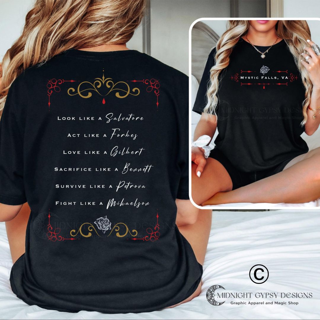 Young woman with long blonde hair wearing a black Mystic Falls shirt from The Vampire Diaries that says look like a Salvatore, Act like a Forbes, Love like a Gilbert, Sacrifice like a Bennett, survive like a Petrova, and fight like a Mikaelson with a rose and red blood drip created by clothing apparel shop Midnight Gypsy Designs as part of their book merch clothing line. Perfect The Vampire Diaries shirt, Team Damon shirt, Team Stefan Shirt, Mystic Falls t-shirt, Vampire Diaries merch, and TVD merch.