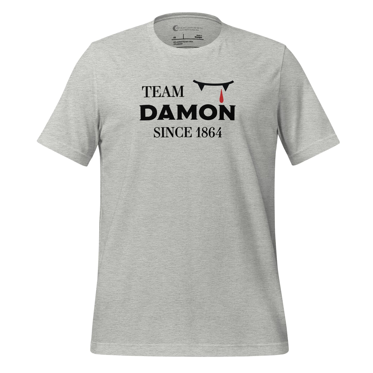 Athletic grey The Vampire Diaries Team Damon Since 1864 shirt with fangs and blood drip created by graphic apparel company Midnight Gypsy Designs. Perfect Team Damon shirt, Damon Salvatore shirt, the Vampire Diaries shirt, cute vampire shirt, team Damon apparel, Salvatore Brothers shirt, team Damon t-shirt, Mystic Falls shirt, and Mystic Falls t-shirt for fans of The Vampire Diaries!