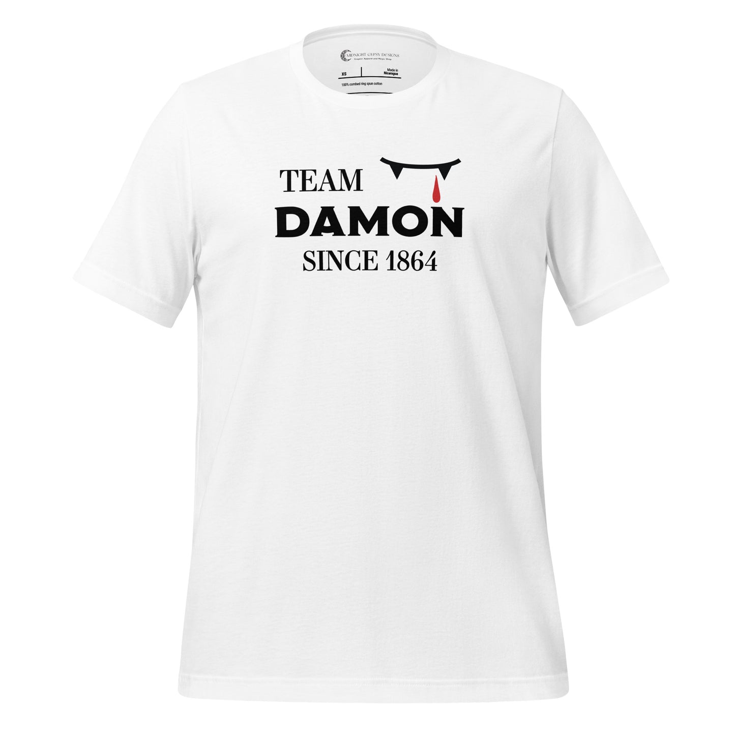White The Vampire Diaries Team Damon Since 1864 shirt with fangs and blood drip created by graphic apparel company Midnight Gypsy Designs. Perfect Team Damon shirt, Damon Salvatore shirt, the Vampire Diaries shirt, cute vampire shirt, team Damon apparel, Salvatore Brothers shirt, team Damon t-shirt, Mystic Falls shirt, and Mystic Falls t-shirt for fans of The Vampire Diaries!