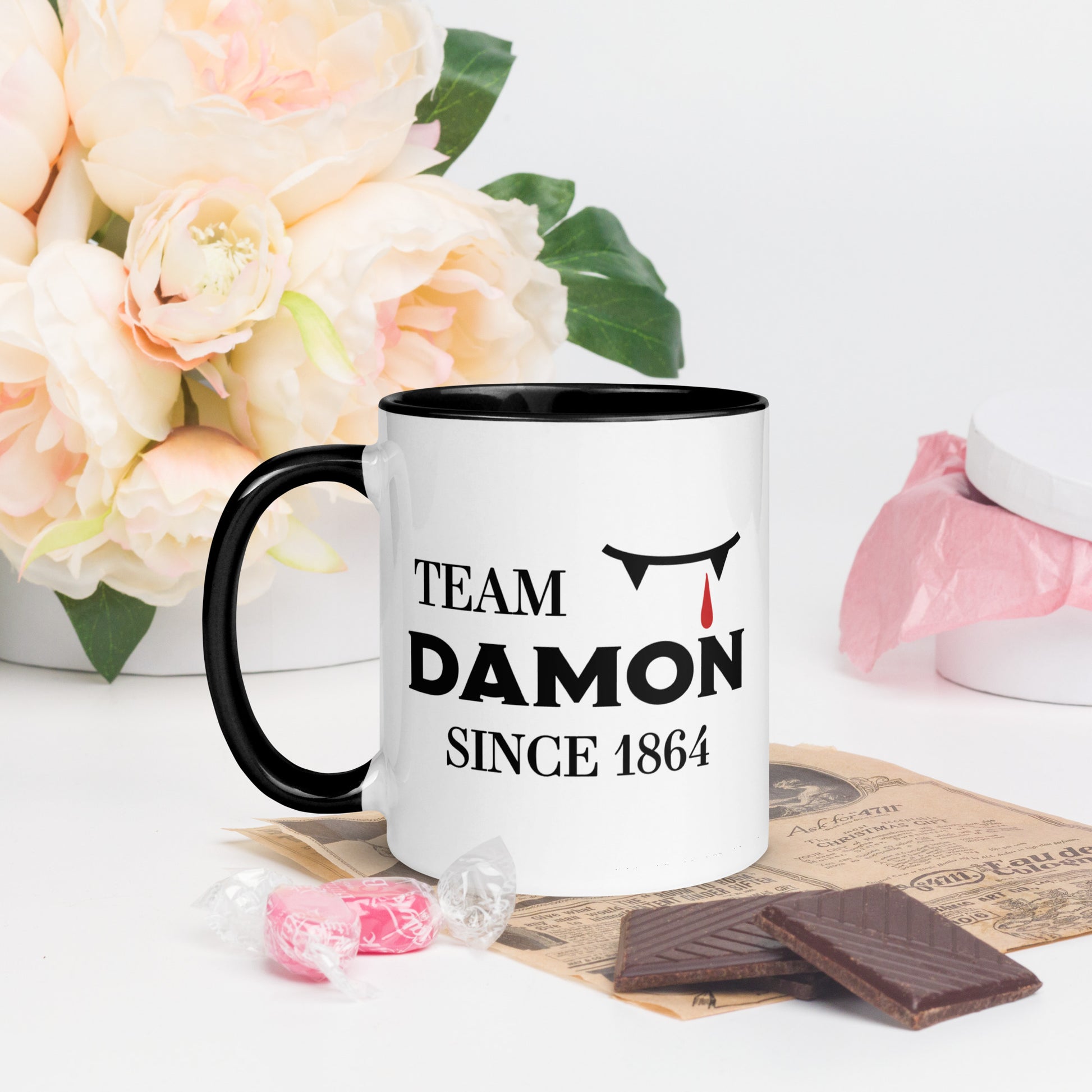 Team Damon Since 1864 mug with vampire teeth and blood drip created by graphic apparel company Midnight Gypsy Designs as part of their The Vampire Diaries mech collection. Perfect Vampire Diaries mug, team Damon mug, Damon Salvatore coffee mug, and Mystic Falls mug!