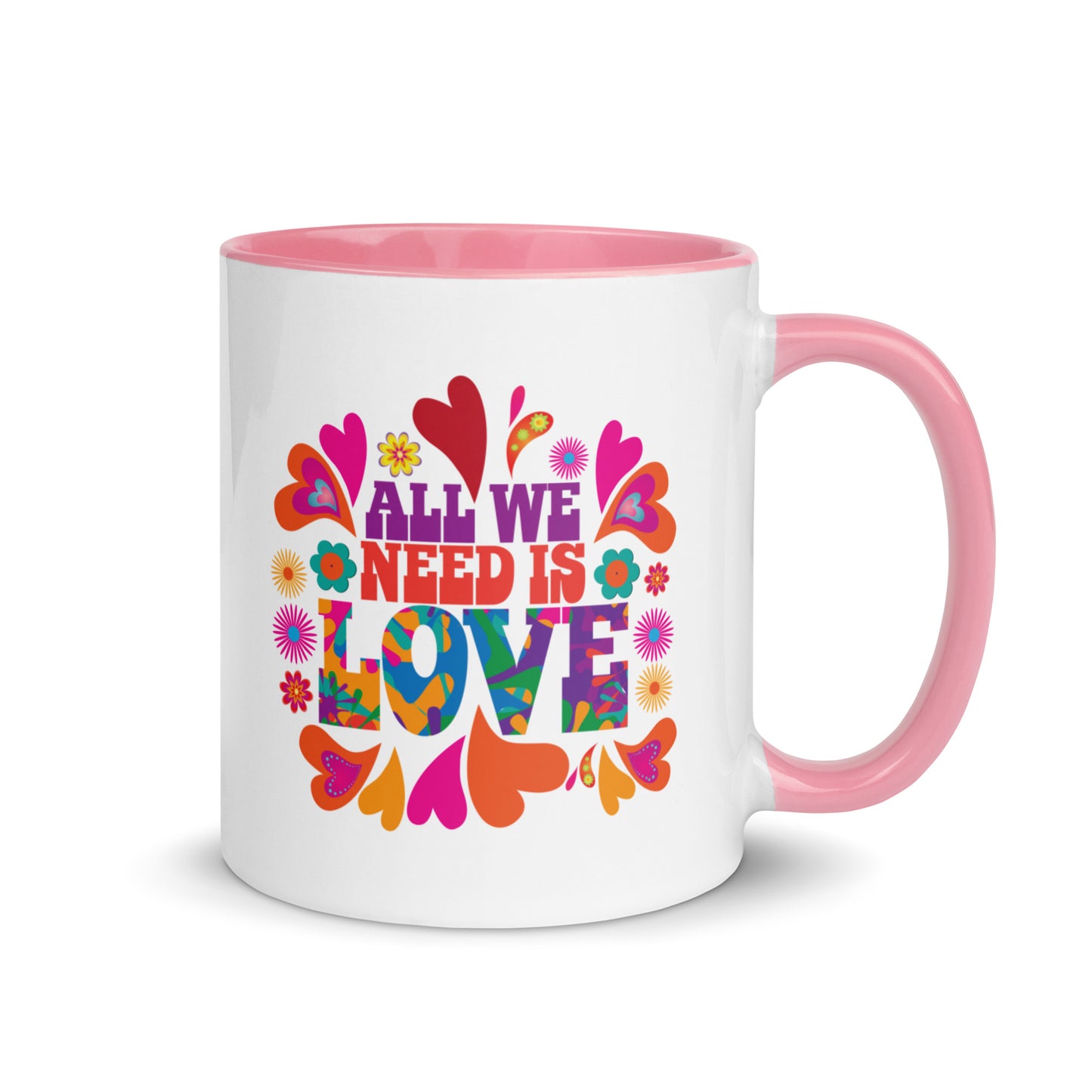 All we need is love coffee mug with pink handle and colorful hearts with 1960s hippie style created by clothing apparel company Midnight Gypsy Designs.
