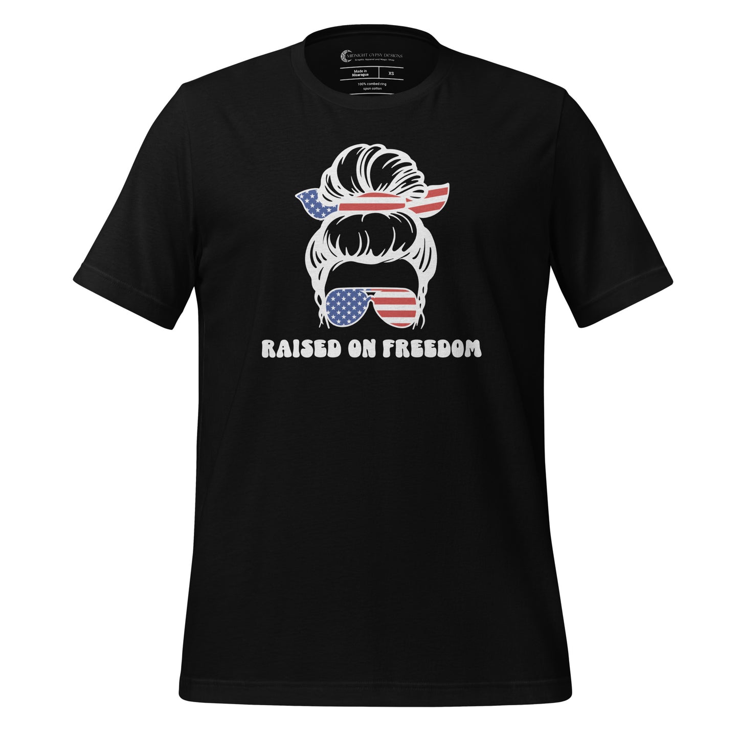 Black Raised on Freedom shirt with graphic of a woman with an American flag hair tie and sunglasses created by graphic apparel company Midnight Gypsy Designs as part of their patriotic apparel collection. Perfect USA patriotic shirt, All American Girl shirt, girl power shirt, American pride shirt, USA shirt, USA flag shirt, womens patriotic shirt, Fourth of July shirt, Patriotic pride shirt, American flag shirt, Independence Day shirt, & American girl shirt.