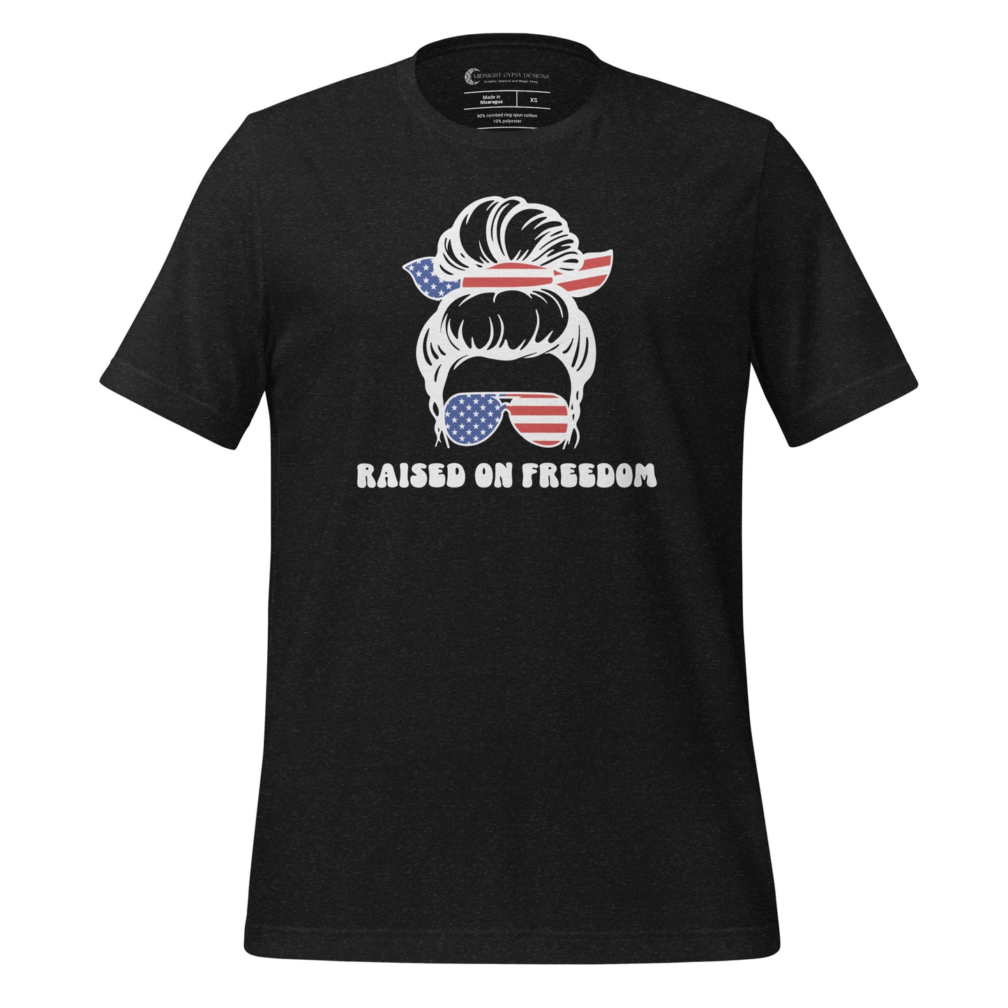 Black Raised on Freedom shirt with graphic of a woman with an American flag hair tie and sunglasses created by graphic apparel company Midnight Gypsy Designs as part of their patriotic apparel collection. Perfect USA patriotic shirt, All American Girl shirt, girl power shirt, American pride shirt, USA shirt, USA flag shirt, womens patriotic shirt, Fourth of July shirt, Patriotic pride shirt, American flag shirt, Independence Day shirt, & American girl shirt.