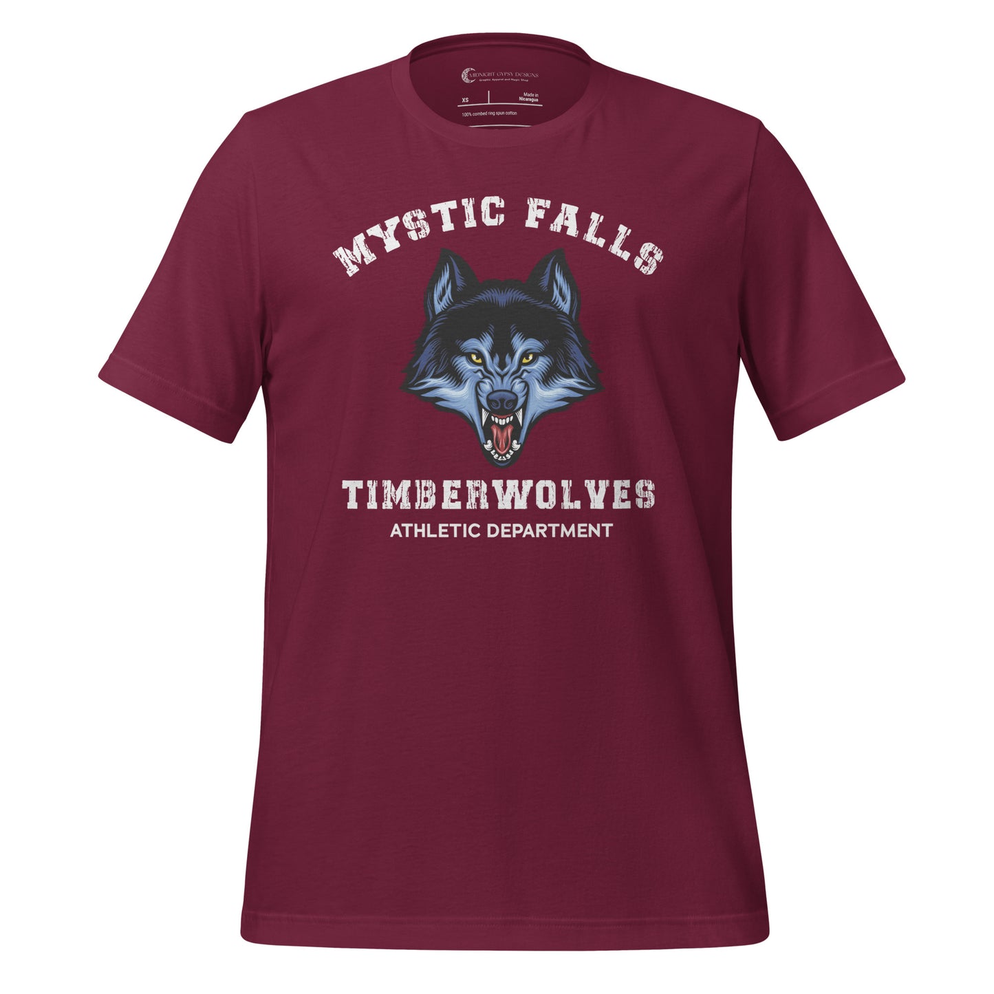 Maroon Mystic Falls Timberwolves shirt with a blue werewolf showing its fangs created by graphic apparel company Midnight Gypsy Designs as part their The Vampire Diaries merch collection. Perfect The Vampire Diaries shirt, Mystic Falls shirt, Mystic Falls Timberwolves t-shirt, Stefan Salvatore shirt, Stefan Salvatore t-shirt, Stefan Salvatore tee, Stefan Salvatore 17 shirt, Mystic Falls High School shirt, Team Stefan shirt, Damon Salvatore shirt, and Team Damon Shirt.