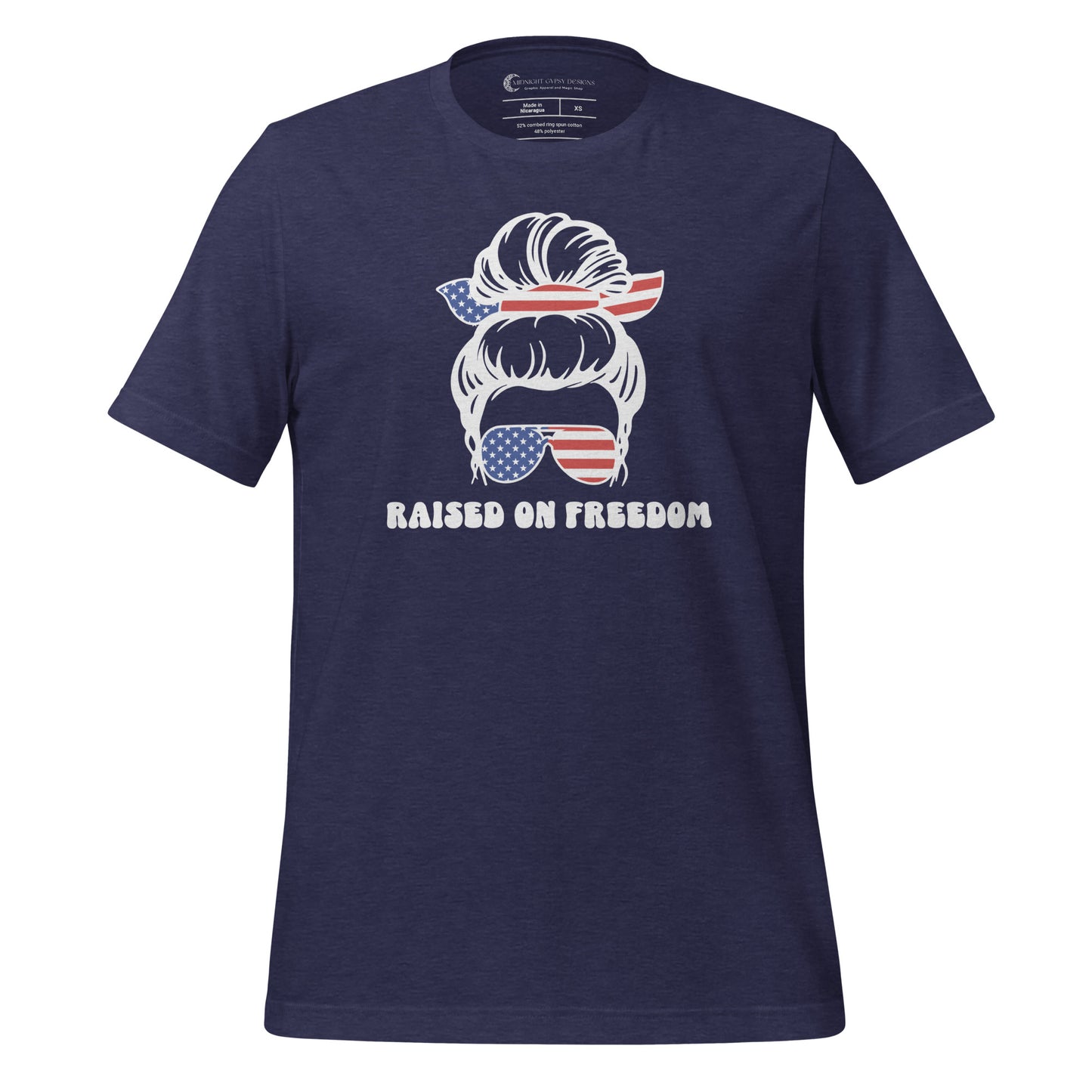 Navy Raised on Freedom shirt with graphic of a woman with an American flag hair tie and sunglasses created by graphic apparel company Midnight Gypsy Designs as part of their patriotic apparel collection. Perfect USA patriotic shirt, All American Girl shirt, girl power shirt, American pride shirt, USA shirt, USA flag shirt, womens patriotic shirt, Fourth of July shirt, Patriotic pride shirt, American flag shirt, Independence Day shirt, & American girl shirt.