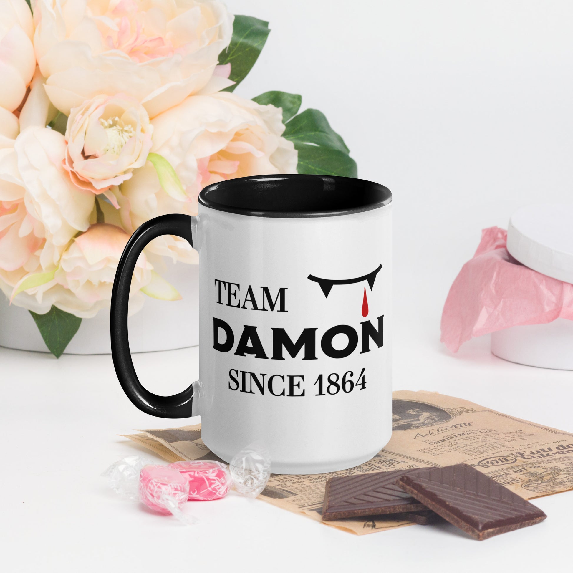 Team Damon Since 1864 mug with vampire teeth and blood drip created by graphic apparel company Midnight Gypsy Designs as part of their The Vampire Diaries mech collection. Perfect Vampire Diaries mug, team Damon mug, Damon Salvatore coffee mug, and Mystic Falls mug!