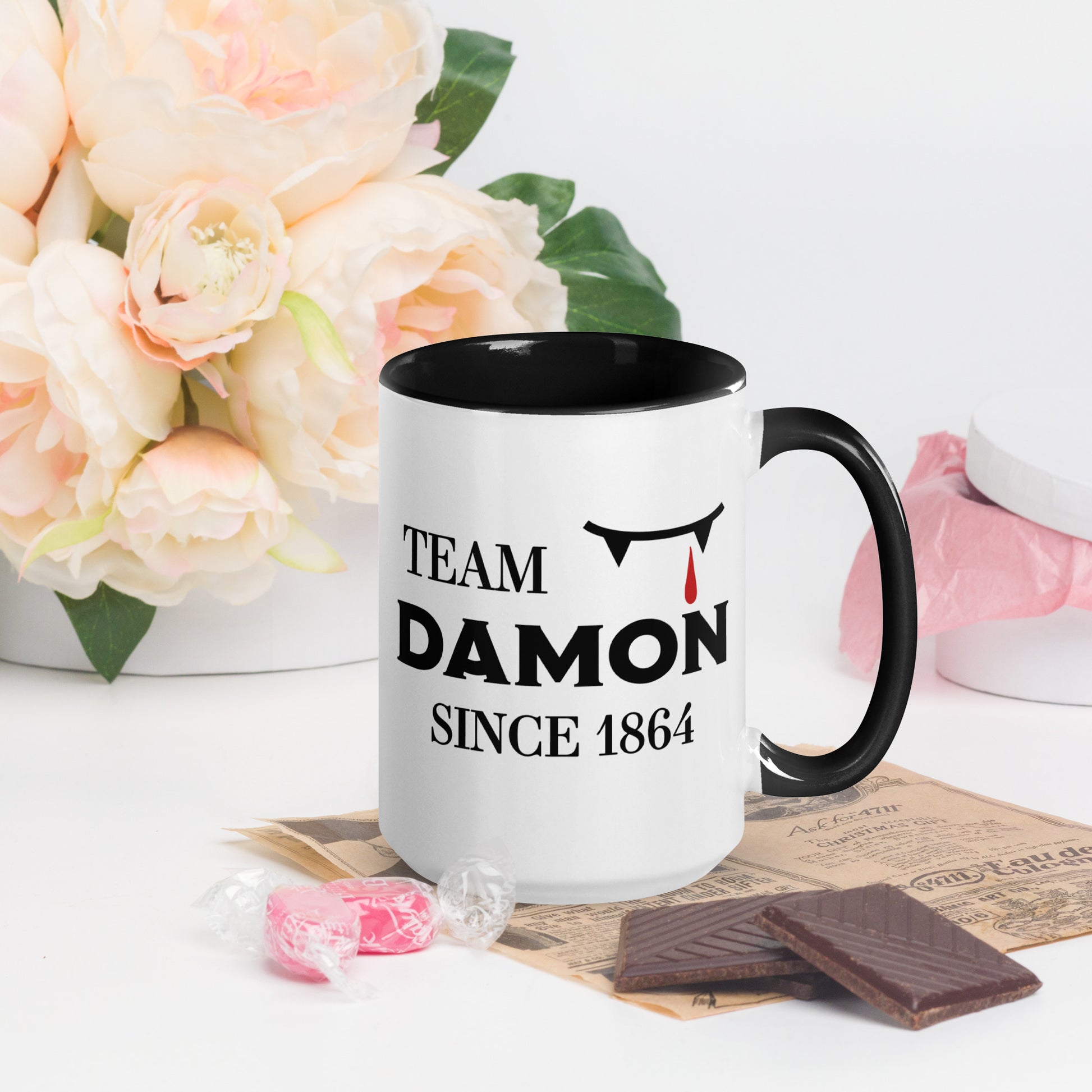 Team Damon Since 1864 mug with vampire teeth and blood drip created by graphic apparel company Midnight Gypsy Designs as part of their The Vampire Diaries mech collection. Perfect Vampire Diaries mug, team Damon mug, Damon Salvatore coffee mug, and Mystic Falls mug!