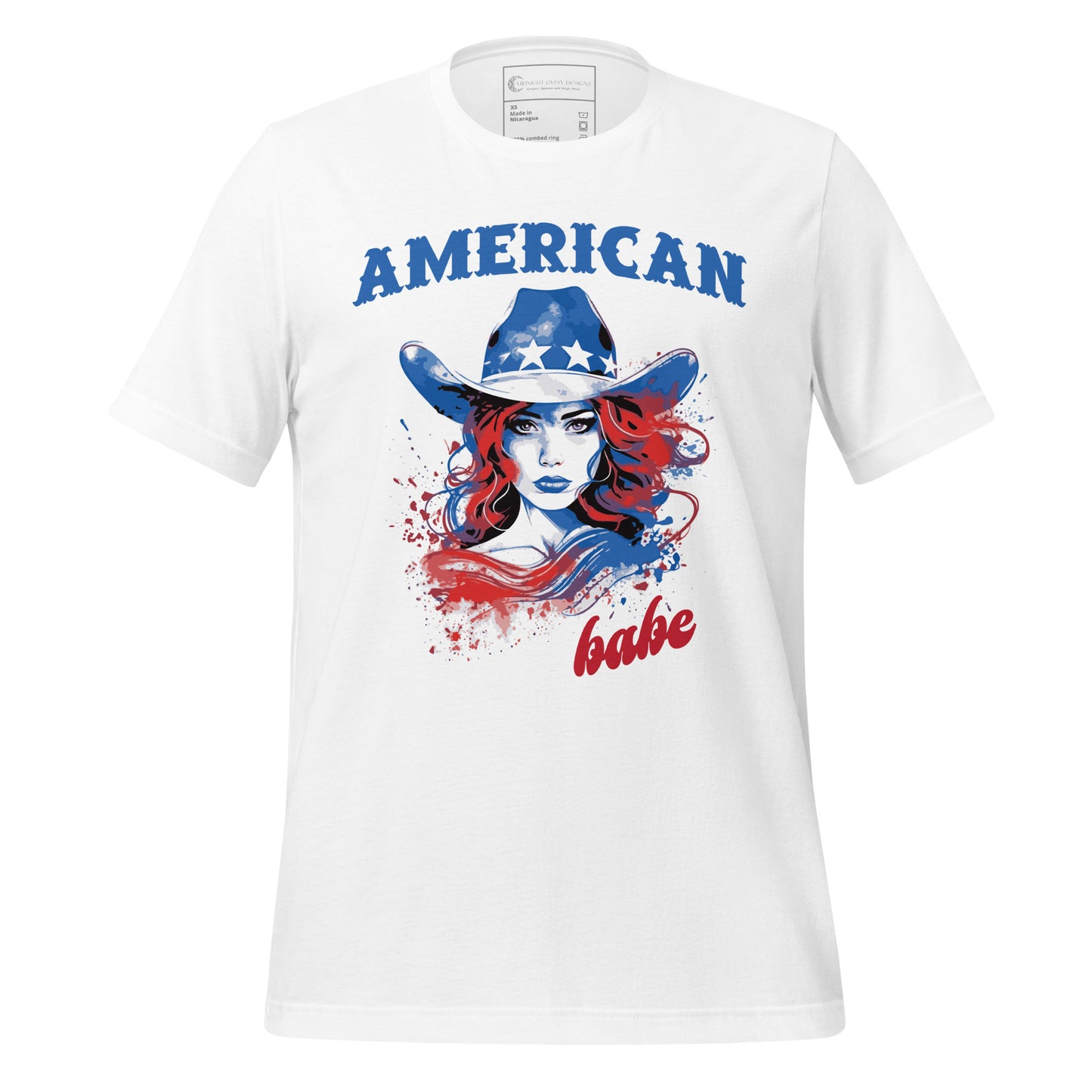 A white Western American Babe shirt that has a woman in a blue cowboy hat with white stars. Created by graphic apparel company Midnight Gypsy Designs as part of their patriotic apparel clothing line. Perfect USA patriotic shirt, fourth of July shirt for women, and American pride shirt.