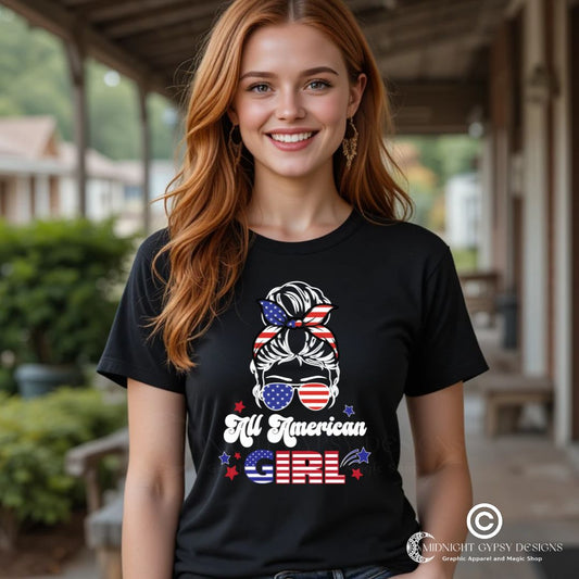 Young woman smiling with long red hair wearing a black All American Girl t-shirt of a patriotic woman with a messy bun in her hair and patriotic aviator sunglasses with red and blue stars created by patriotic apparel clothing shop Midnight Gypsy Designs as part of their USA patriotic shirt line.