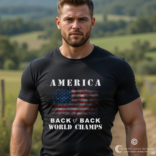 Young man with beard standing outside wearing a black American patriotic pride shirt that says America Back to Back World Champs designed by graphic apparel company Midnight Gypsy Designs as part of their USA Patriotic apparel line. Perfect USA veteran shirt, USA patriotic shirt, Fourth of July Shirt, American pride shirt, USA flag shirt, USA patriot shirt, USA military shirt, and veteran warrior shirt for those who wave the red, white, and blue!