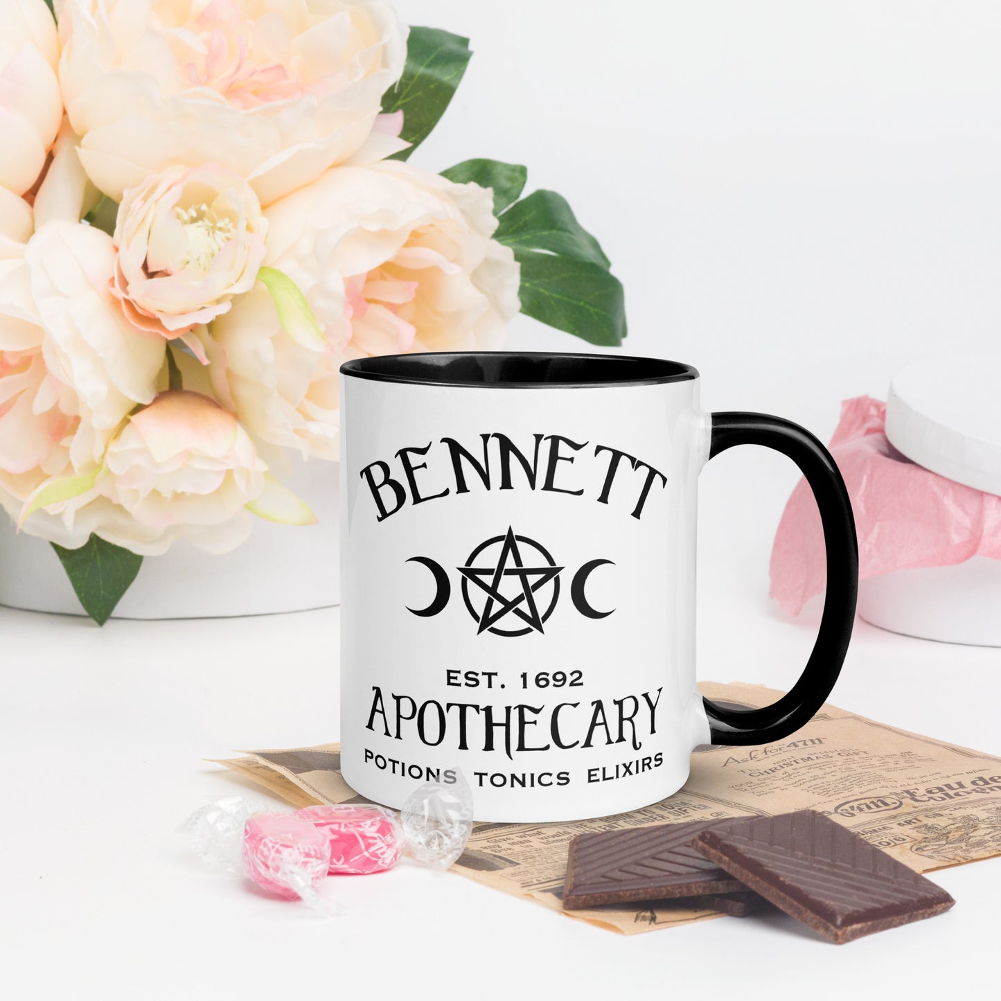 Black and white ceramic coffee mug with words Bennett Apothecary Established 1692 Potions Tonics Elixirs with moon and witch pentacle inspired by Bonnie Bennett from The Vampire Diaries created by the Midnight Gypsy Designs shop. 