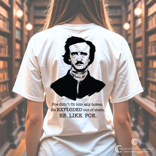 Young woman in a library wearing a white Edgar Allan Poe shirt that says Be Like Poe  created by graphic apparel company Midnight Gypsy Designs as part of their Dark Academia t-shirt collection. Perfect Edgar Allan Poe merch, Edgar Allan Poe fans shirt, Edgar Allan Poe literary shirt, Edgar Allan Poe Poet shirt, Edgar Allan Poe librarian shirt, and Edgar Allan Poe fan shirt for readers.