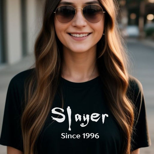 Young woman with long brown hair smiling while wearing brown aviator sunglasses and a black Slayer Since 1996 Buffy the Vampire Slayer t-shirt created by clothing apparel shop Midnight Gypsy Designs.