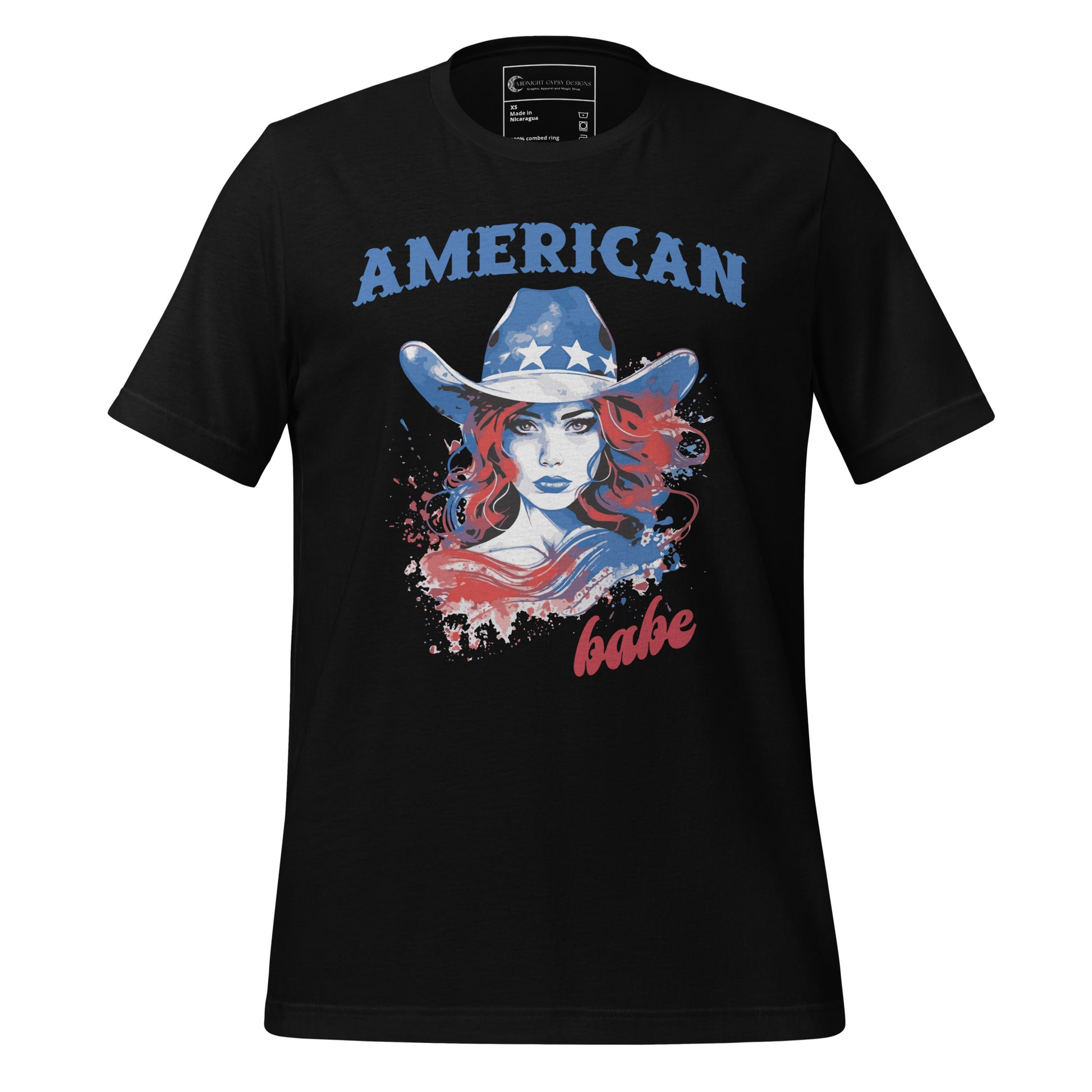 A black Western American Babe shirt that has a woman in a blue cowboy hat with white stars. Created by graphic apparel company Midnight Gypsy Designs as part of their patriotic apparel clothing line. Perfect USA patriotic shirt, fourth of July shirt for women, and American pride shirt.