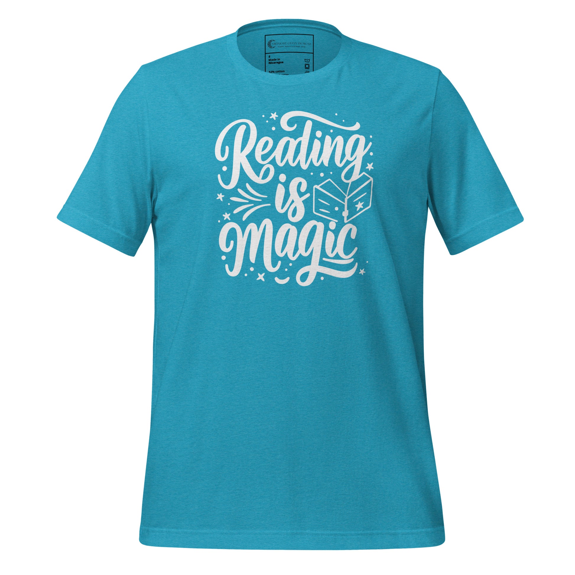 Blue reading is magic shirt with a dragon flying in clouds and stars over a castle and open book created by graphic apparel company Midnight Gypsy Designs as part of their bookish merch apparel line.