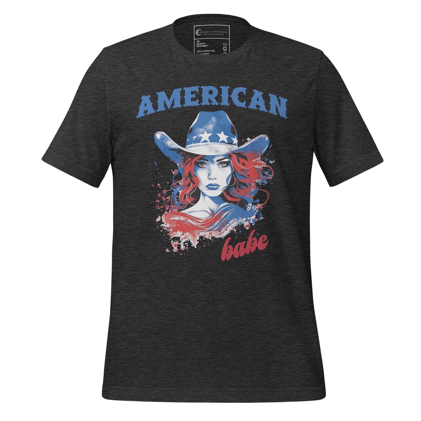A grey Western American Babe shirt that has a woman in a blue cowboy hat with white stars. Created by graphic apparel company Midnight Gypsy Designs as part of their patriotic apparel clothing line. Perfect USA patriotic shirt, fourth of July shirt for women, and American pride shirt.