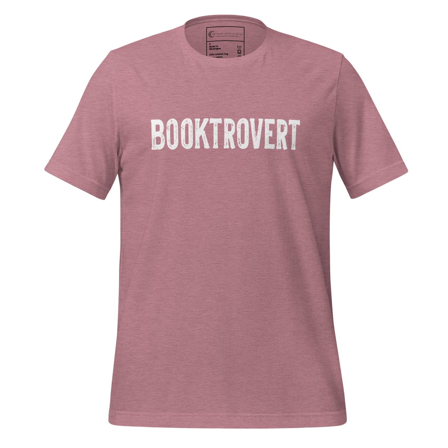 Pink booktrovert definition shirt in bold white letters created by graphic apparel company Midnight Gypsy Designs as part of their bookish merch clothing line.