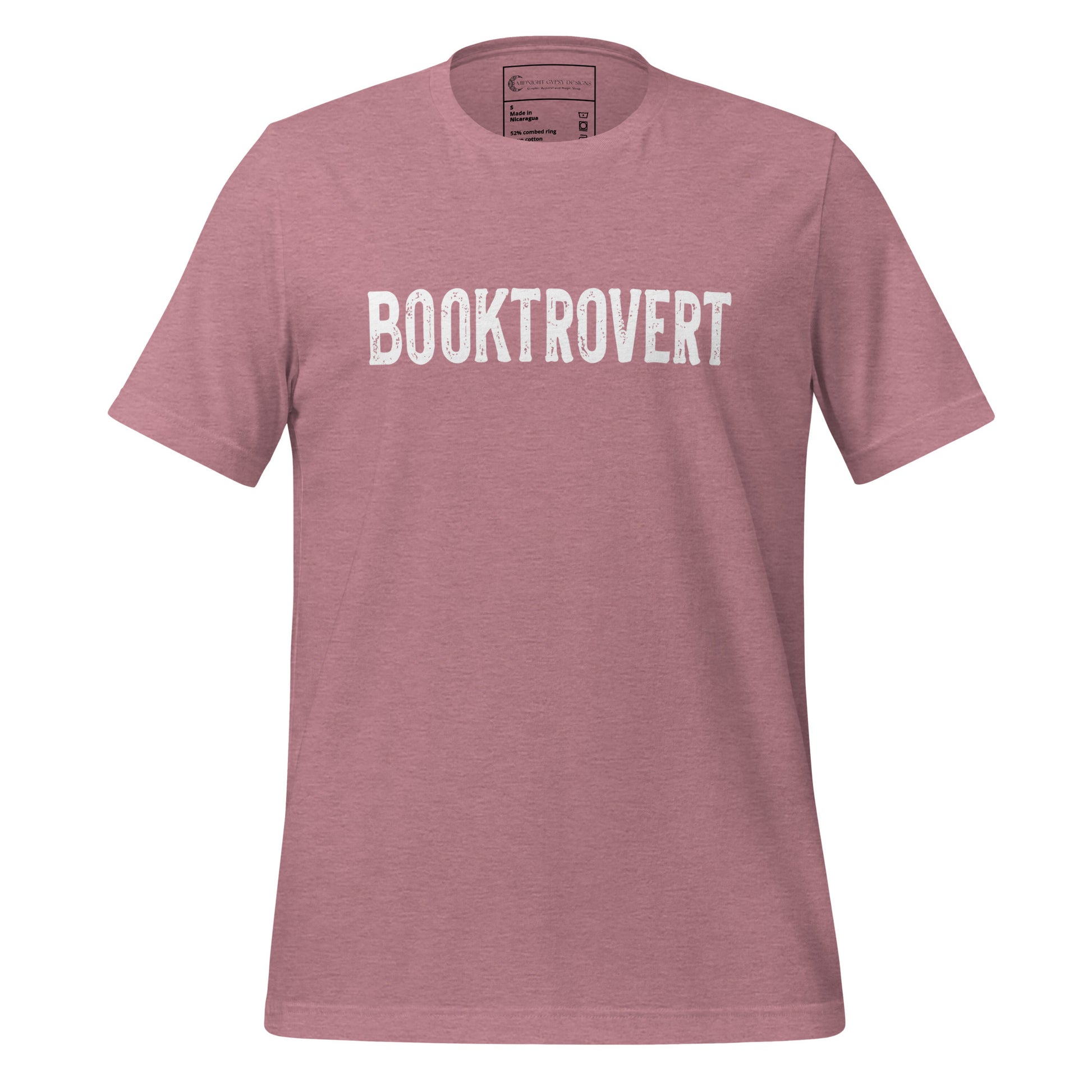 Pink booktrovert definition shirt in bold white letters created by graphic apparel company Midnight Gypsy Designs as part of their bookish merch clothing line.