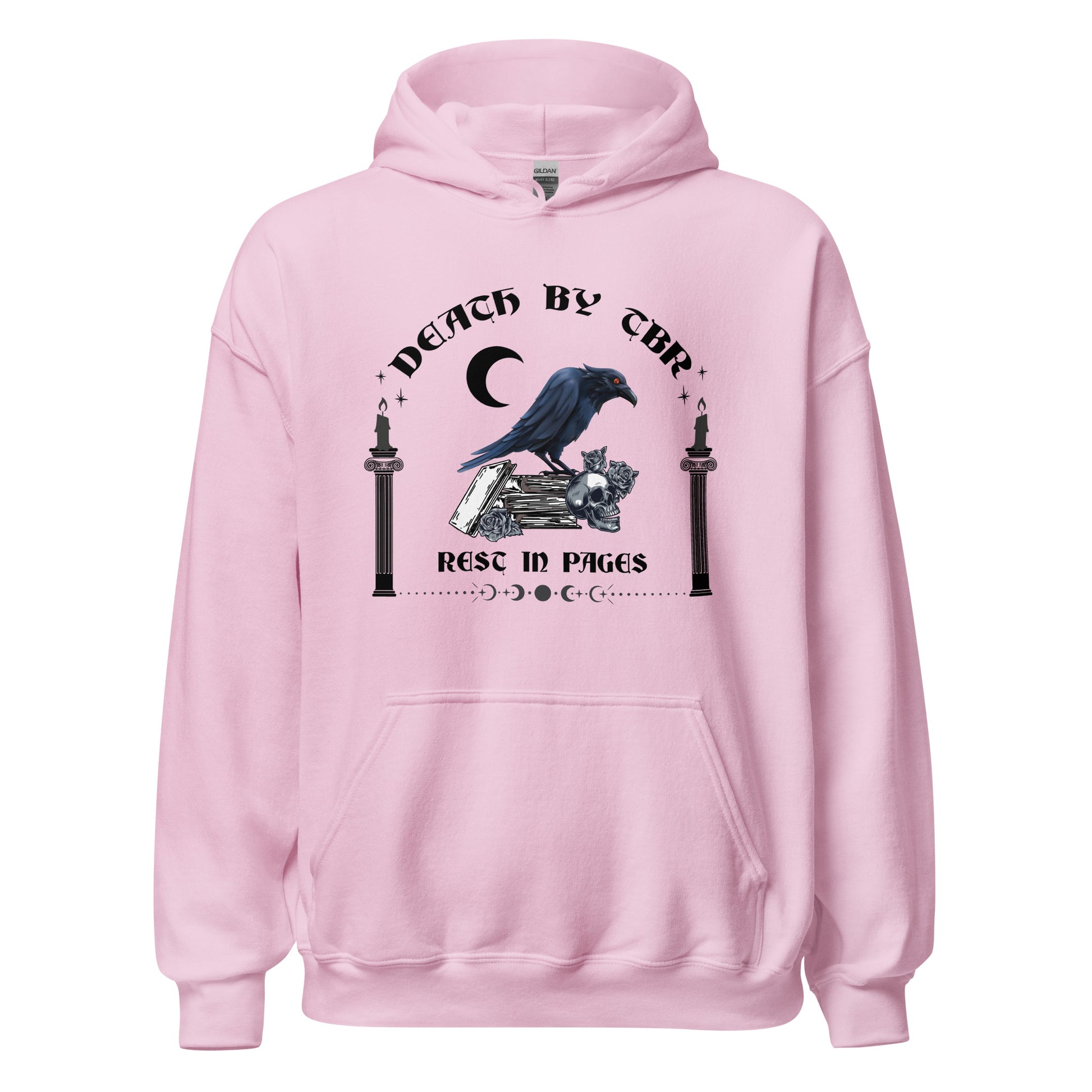 Pink Gildan hoodie that reads Death By TBR Rest In Pages with moon, raven standing on a book stack, a skull, and two burning candles from bookish shop Midnight Gypsy Designs.