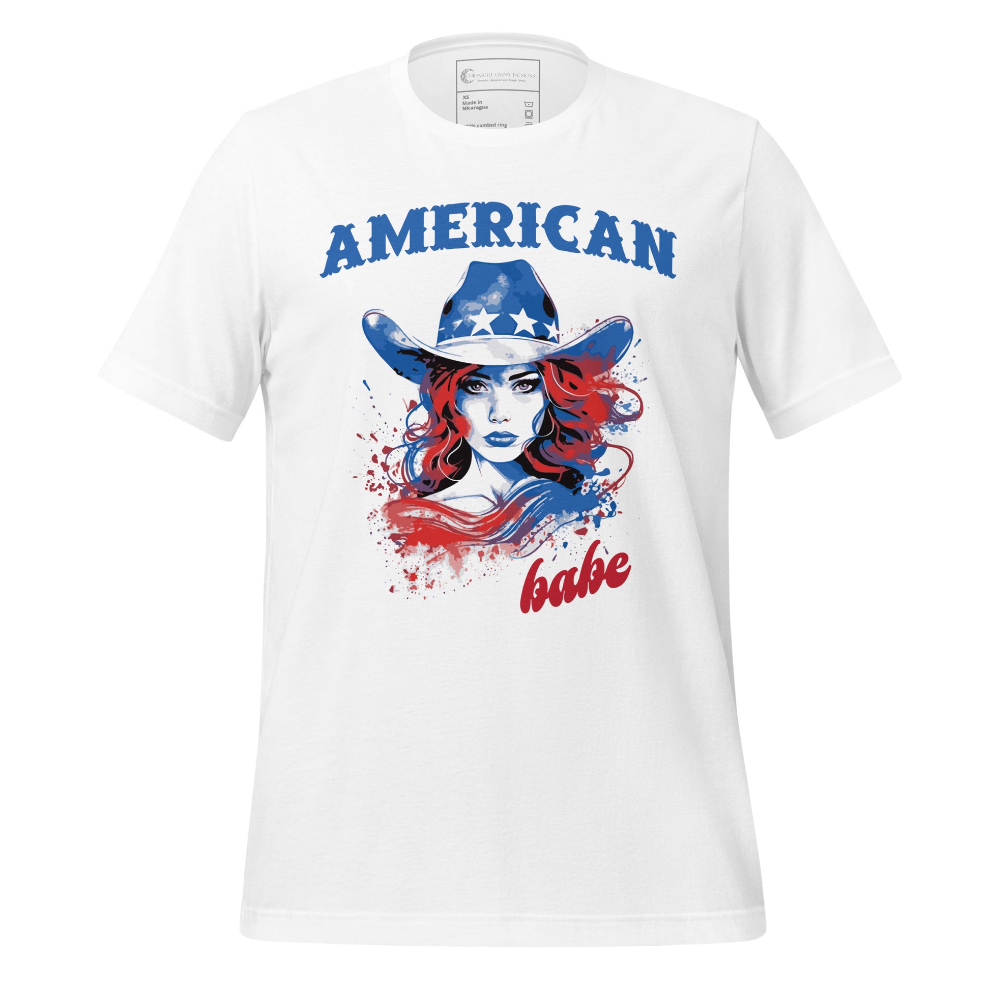 A white Western American Babe shirt that has a woman in a blue cowboy hat with white stars. Created by graphic apparel company Midnight Gypsy Designs as part of their patriotic apparel clothing line. Perfect USA patriotic shirt, fourth of July shirt for women, and American pride shirt.